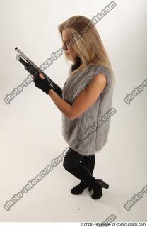 18 2018 01 NIKOL STANDING POSE WITH SHOTGUN